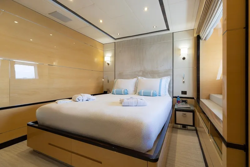 Inspiration Yacht Photos Pics Luxurious bedroom interior on 2018 Benetti Fast 125 yacht, featuring elegant design and cozy ambiance.