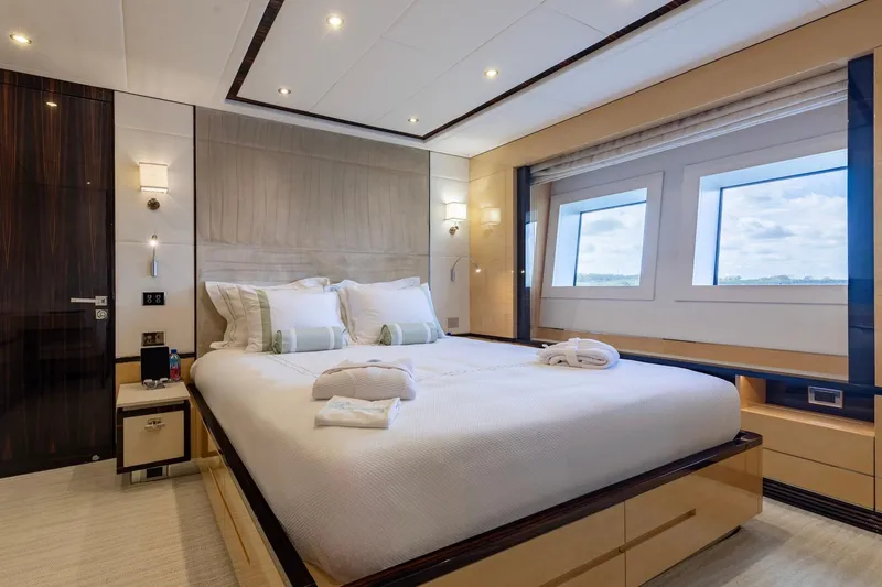 Inspiration Yacht Photos Pics Luxurious bedroom interior on 2018 Benetti Fast 125 yacht, featuring elegant design and large windows.