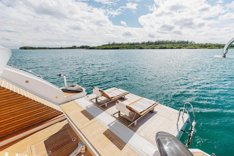 Inspiration Yacht Photos Pics Luxurious 2018 Benetti Fast 125 yacht deck with sun loungers overlooking serene ocean waters.