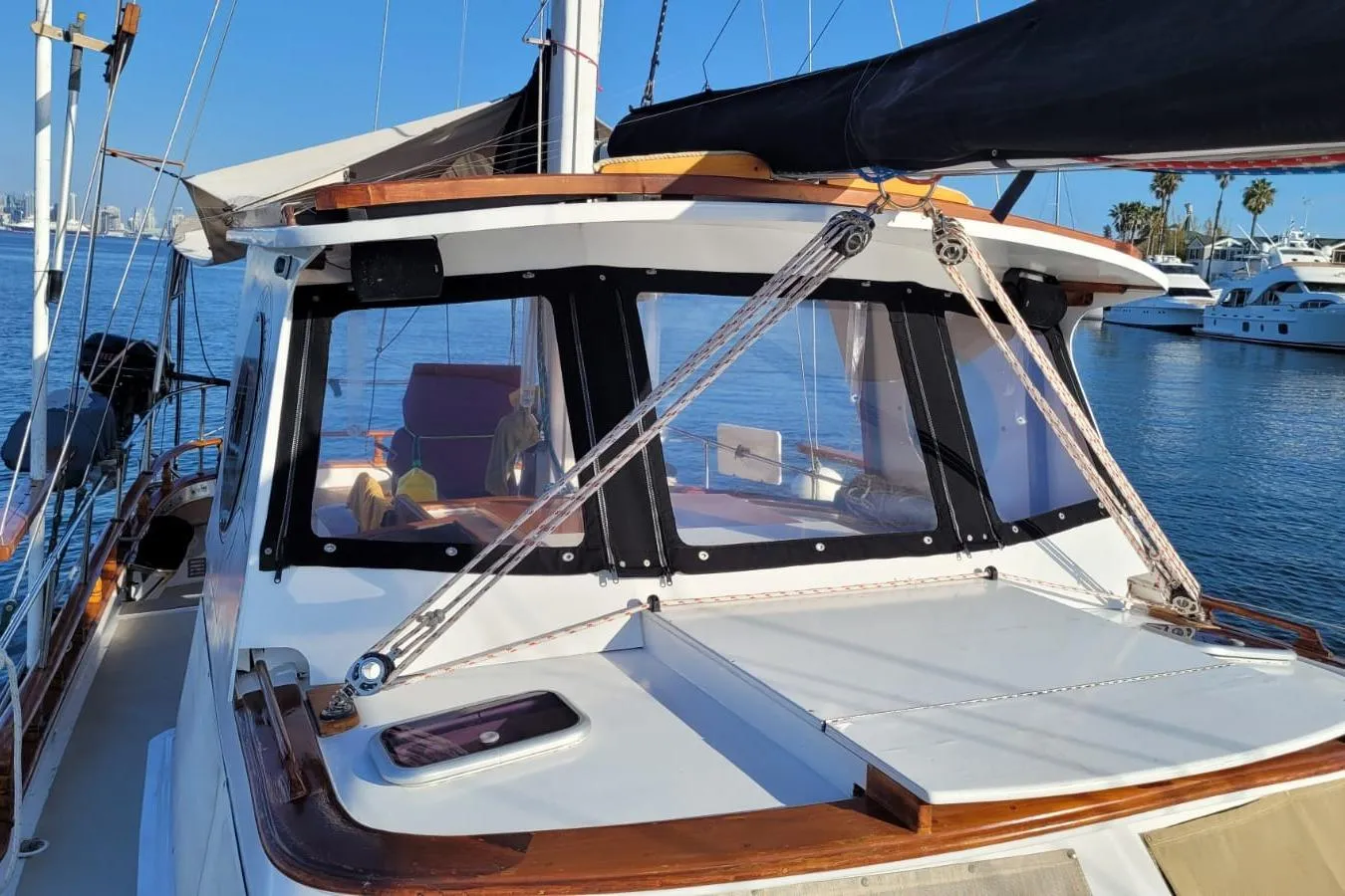 1974 Force Hudson 50 sailboat docked, featuring a sleek cabin and clear blue waters.