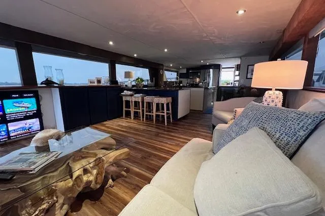  Yacht Photos Pics Luxurious interior of 1989 Hatteras 70 Cockpit Motor Yacht with modern furnishings.