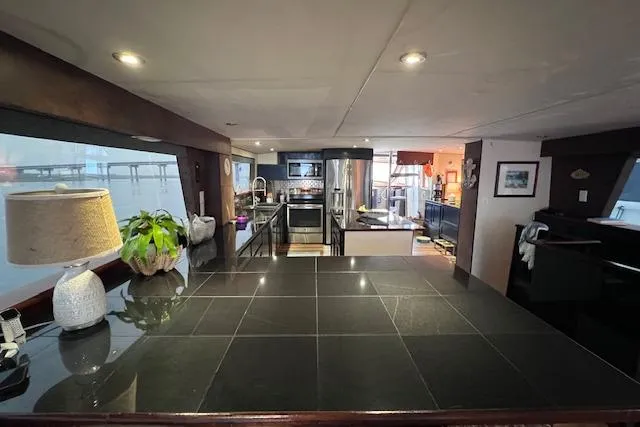  Yacht Photos Pics Interior of 1989 Hatteras 70 Cockpit Motor Yacht with modern kitchen and sleek design.