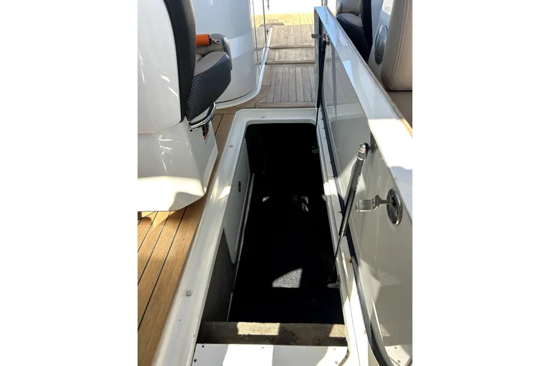  Yacht Photos Pics 2016 Sea Ray 350 SLX boat interior with open storage compartment and seating.