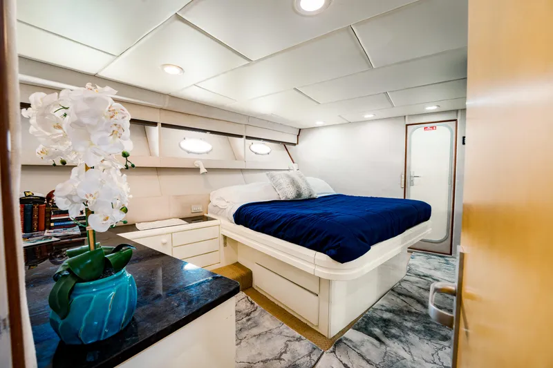 Justine Yacht Photos Pics Luxurious 1987 Guy Couach 97 yacht bedroom with elegant decor and modern amenities.