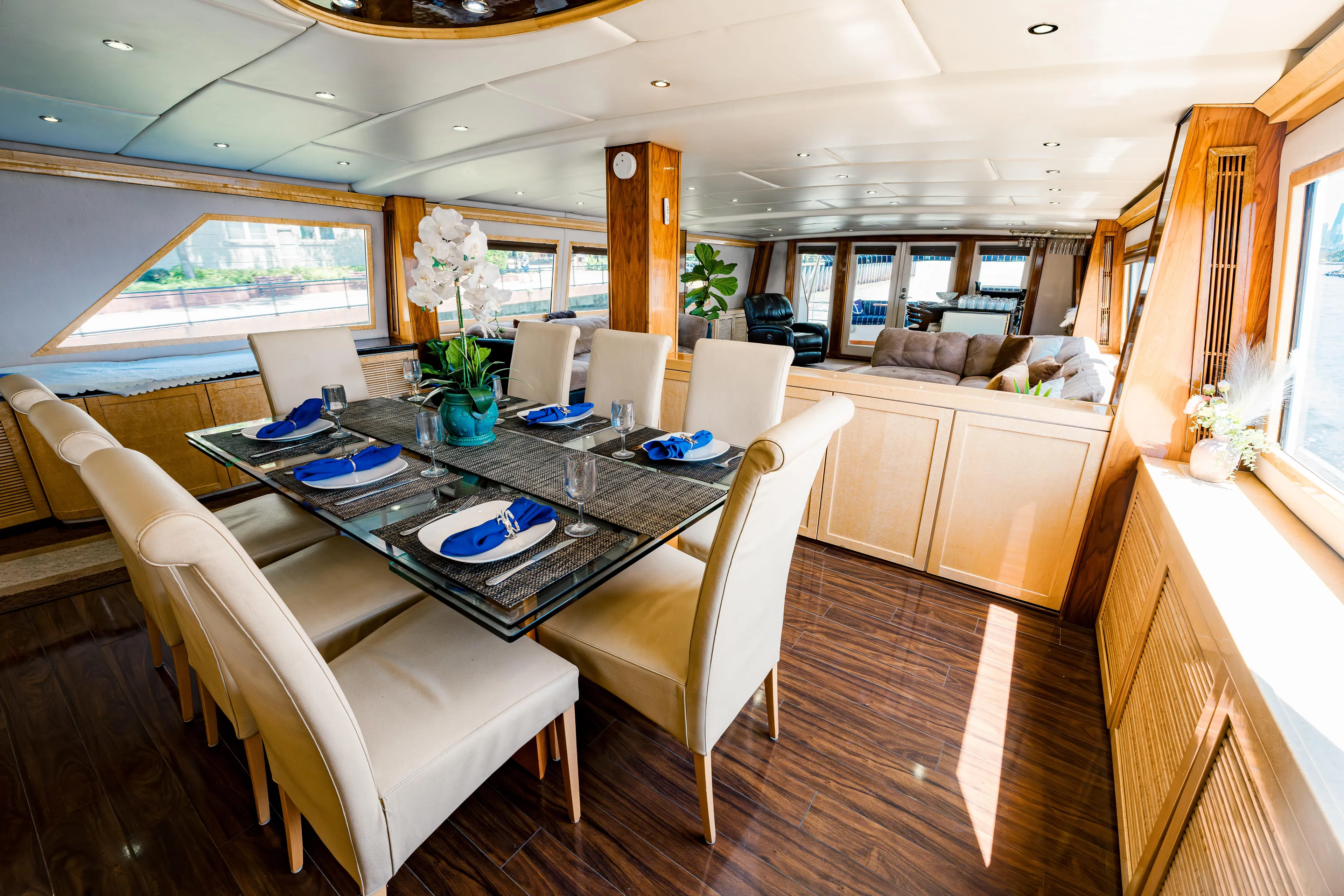 Justine Yacht Photos Pics Luxurious dining area on a 1987 Guy Couach 97 yacht with elegant table setting.