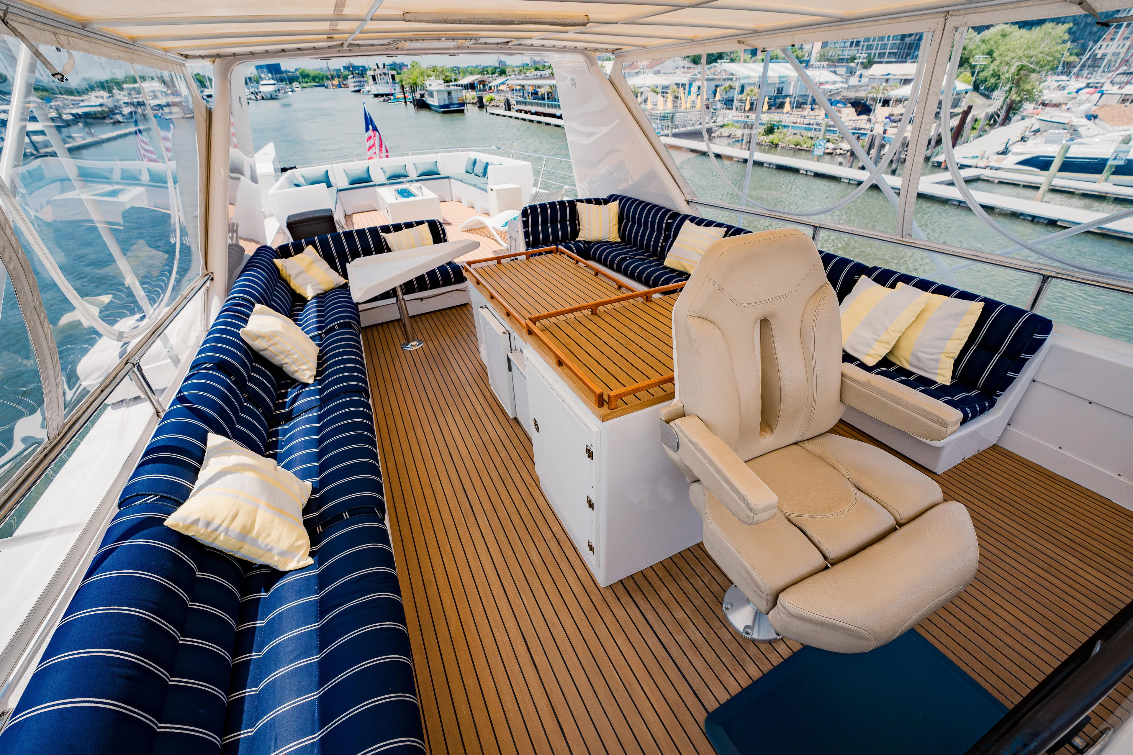 Justine Yacht Photos Pics Luxurious 1987 Guy Couach 97 yacht interior with plush seating and elegant design.