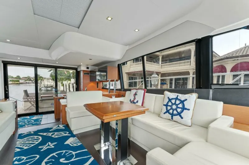 Never Enough Yacht Photos Pics Luxurious interior of 2013 Prestige 550 Flybridge yacht with nautical-themed decor.