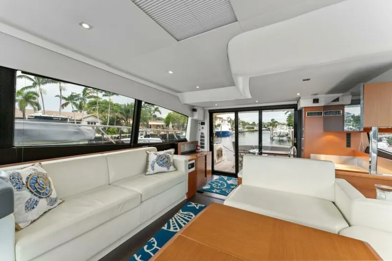 Never Enough Yacht Photos Pics Luxurious interior of 2013 Prestige 550 Flybridge yacht with elegant seating and scenic views.