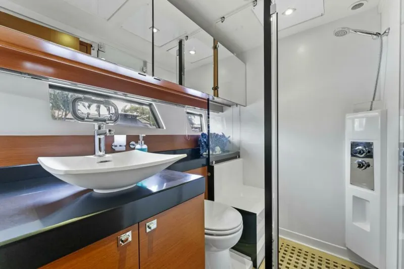 Never Enough Yacht Photos Pics Luxurious bathroom in 2013 Prestige 550 Flybridge yacht with modern fixtures and elegant design.