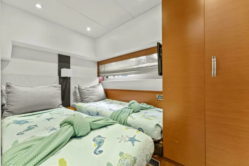 Never Enough Yacht Photos Pics Twin bedroom in 2013 Prestige 550 Flybridge yacht with modern decor and natural light.