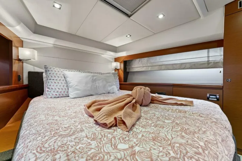 Never Enough Yacht Photos Pics Luxurious bedroom interior of 2013 Prestige 550 Flybridge yacht with cozy bedding.