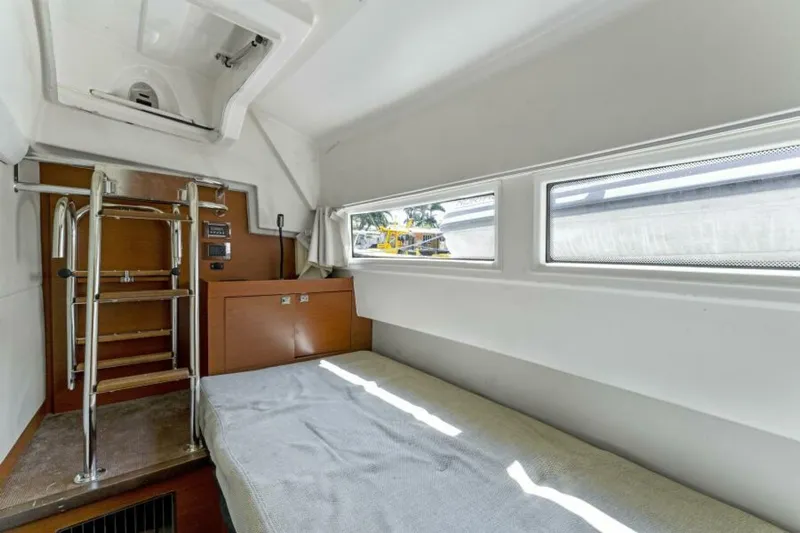 Never Enough Yacht Photos Pics Interior cabin of 2013 Prestige 550 Flybridge yacht with bed and windows.