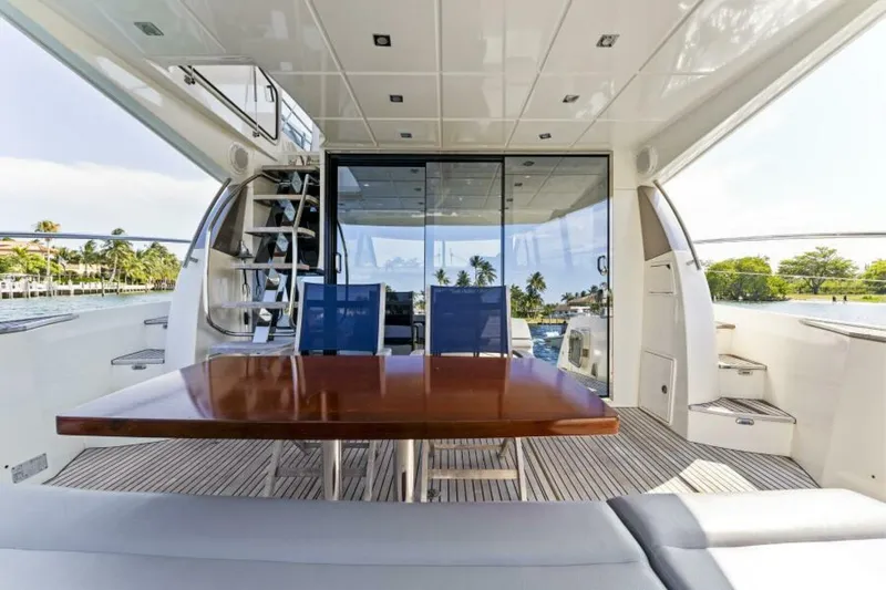 Never Enough Yacht Photos Pics Luxurious 2013 Prestige 550 Flybridge yacht interior with elegant dining area and scenic views.
