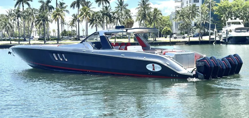  Yacht Photos Pics 2020 Cigarette 59 Tirranna luxury speedboat on water, surrounded by palm trees.