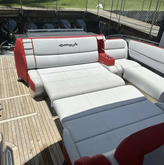  Yacht Photos Pics 2020 Cigarette 59 Tirranna boat with luxurious red and white seating on a wooden deck.