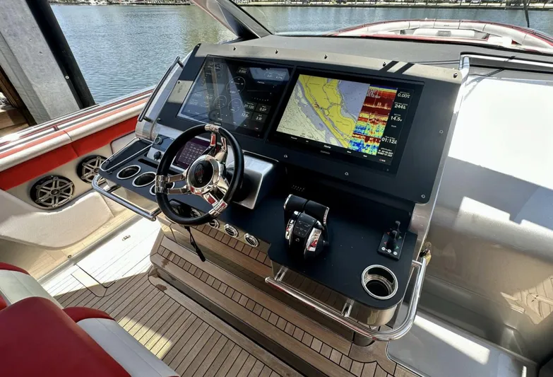  Yacht Photos Pics Cockpit of 2020 Cigarette 59 Tirranna with advanced navigation displays and controls.