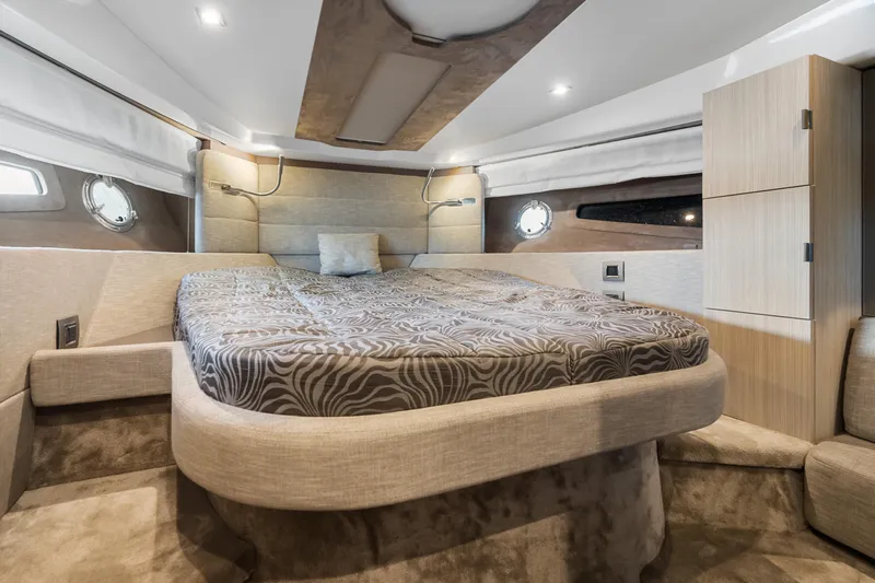  Yacht Photos Pics Luxurious cabin interior of 2023 Cranchi M44HT yacht with elegant bedding and modern design.