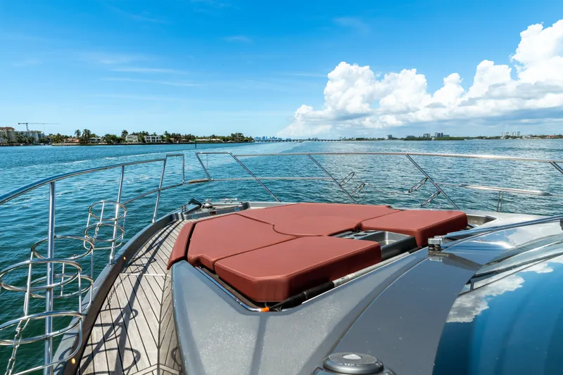  Yacht Photos Pics 2023 Cranchi M44HT yacht deck with sun loungers, cruising on a sunny day.