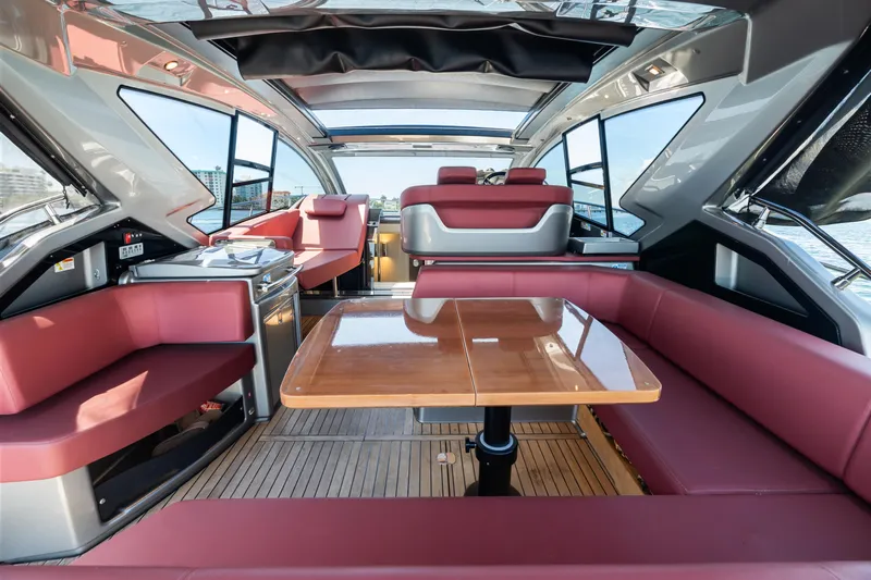  Yacht Photos Pics Luxurious interior of 2023 Cranchi M44HT yacht with elegant seating and dining area.