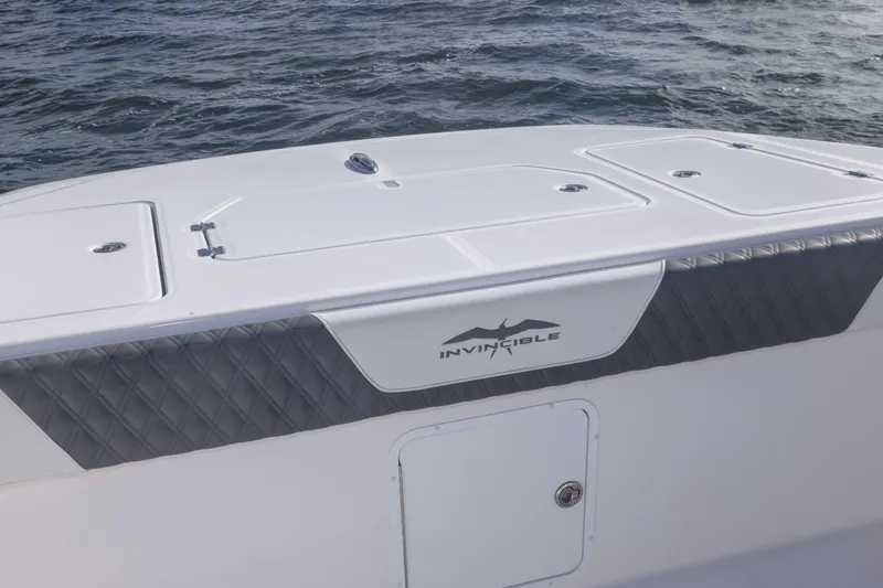  Yacht Photos Pics 2023 Invincible 35 Catamaran boat deck with ocean backdrop.