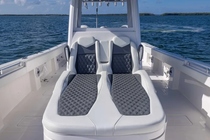  Yacht Photos Pics Luxurious seating on 2023 Invincible 35 Catamaran, featuring sleek design and ocean backdrop.