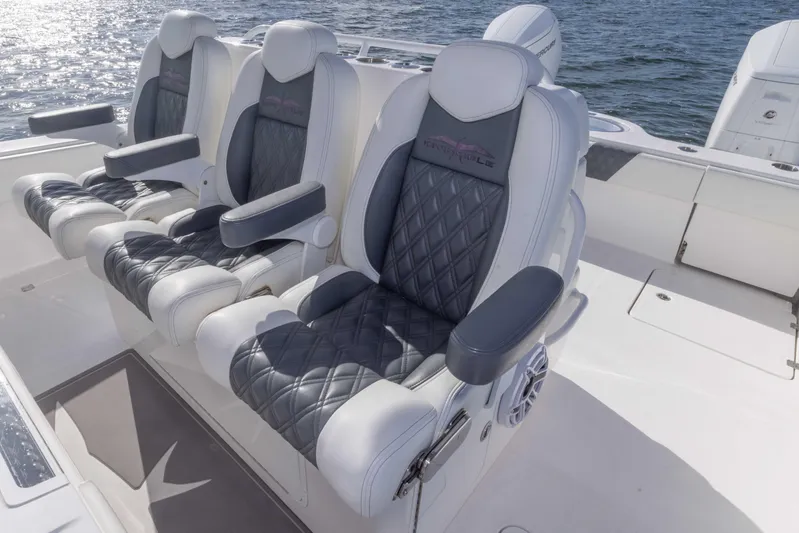  Yacht Photos Pics Luxury seating on 2023 Invincible 35 Catamaran, featuring plush, diamond-stitched upholstery.