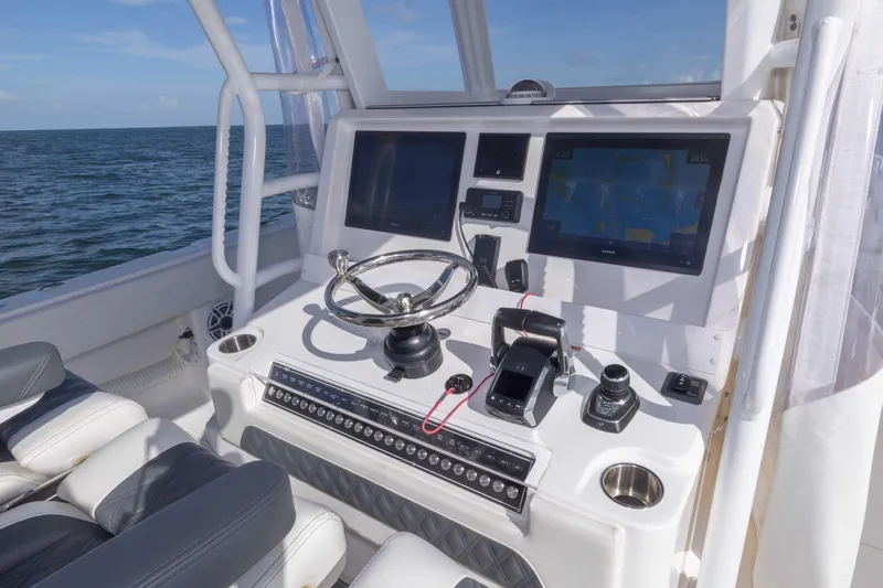  Yacht Photos Pics 2023 Invincible 35 Catamaran helm with advanced navigation systems and controls.