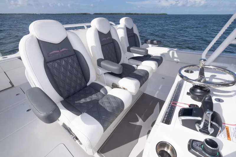  Yacht Photos Pics Luxury seating on 2023 Invincible 35 Catamaran, featuring sleek design and ocean backdrop.