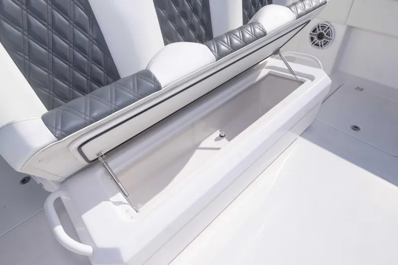  Yacht Photos Pics 2023 Invincible 35 Catamaran seat storage with diamond-stitched upholstery.