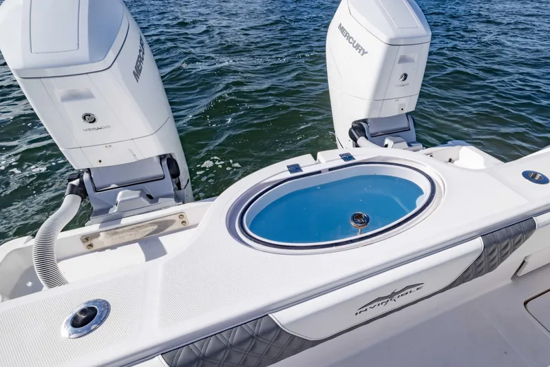  Yacht Photos Pics 2023 Invincible 35 Catamaran with dual Mercury engines and livewell on open water.