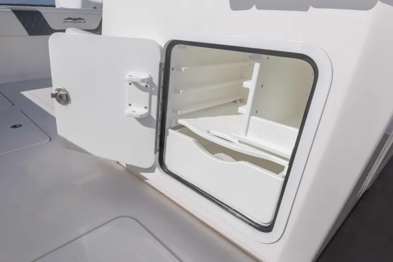  Yacht Photos Pics Open storage compartment on 2023 Invincible 35 Catamaran boat interior.
