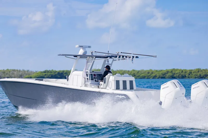  Yacht Photos Pics 2023 Invincible 35 Catamaran cruising on open water, showcasing sleek design and powerful engines.