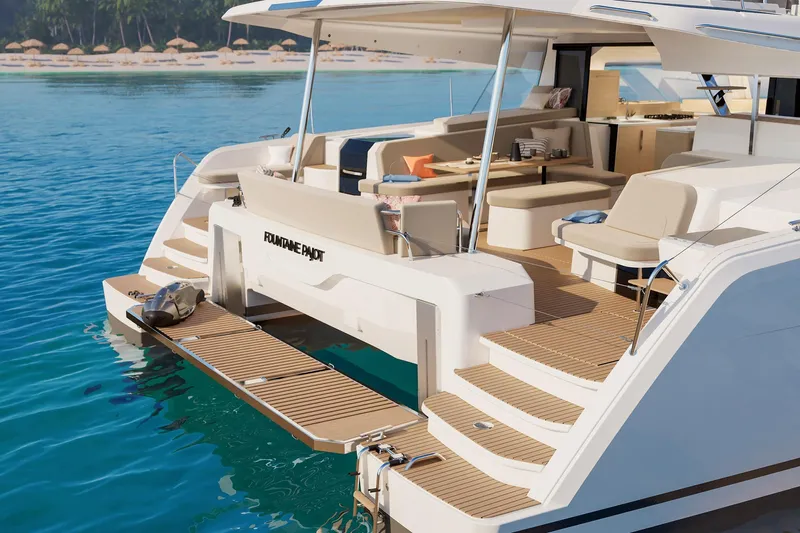  Yacht Photos Pics Luxurious 2026 Fountaine Pajot FP 48 yacht with elegant deck and seating, near tropical beach.