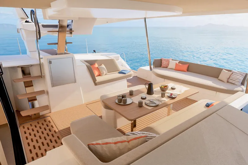  Yacht Photos Pics Luxurious 2026 Fountaine Pajot FP 48 yacht interior with elegant seating and ocean view.