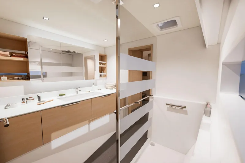  Yacht Photos Pics Luxurious bathroom interior of 2026 Fountaine Pajot FP 48 yacht, featuring modern design elements.