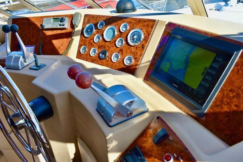 "magic" Yacht Photos Pics 2004 Meridian 490 Pilothouse dashboard with navigation screen and control levers.