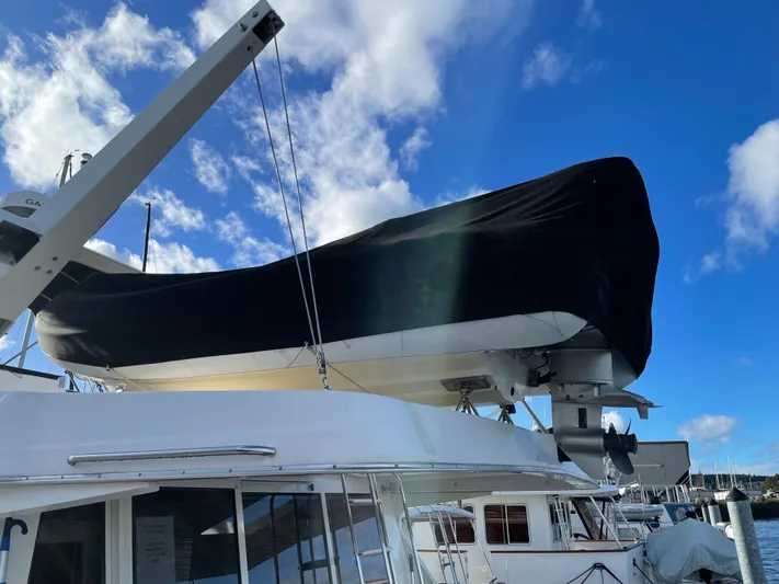 "magic" Yacht Photos Pics 2004 Meridian 490 Pilothouse yacht with covered upper deck, docked under a blue sky.