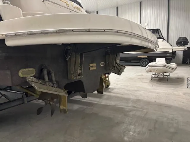 Daddy Cool Yacht Photos Pics 2008 Sea Ray 52 Sundancer in a boat storage facility, showcasing the stern and propellers.