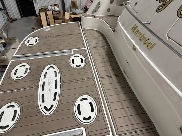 Daddy Cool Yacht Photos Pics 2008 Sea Ray 52 Sundancer yacht deck with teak flooring, docked in a marina.