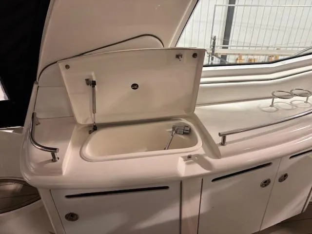 Daddy Cool Yacht Photos Pics 2008 Sea Ray 52 Sundancer yacht interior with open sink and storage compartments.