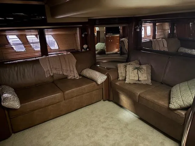 Daddy Cool Yacht Photos Pics Luxurious interior of 2008 Sea Ray 52 Sundancer yacht with plush brown seating.