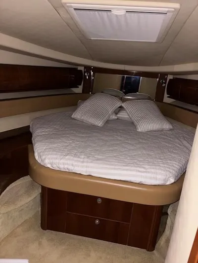 Daddy Cool Yacht Photos Pics Luxurious cabin interior of 2008 Sea Ray 52 Sundancer yacht with cozy bed and pillows.