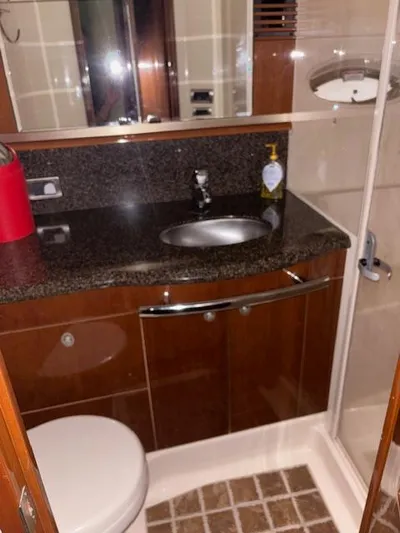 Daddy Cool Yacht Photos Pics Luxurious bathroom in 2008 Sea Ray 52 Sundancer yacht with granite countertop and shower.