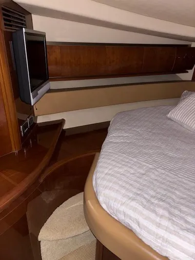 Daddy Cool Yacht Photos Pics Luxurious cabin interior of 2008 Sea Ray 52 Sundancer yacht with bed and TV.