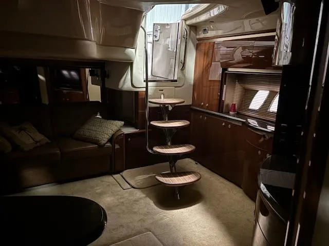 Daddy Cool Yacht Photos Pics Interior of 2008 Sea Ray 52 Sundancer yacht with elegant wood finishes and spiral staircase.