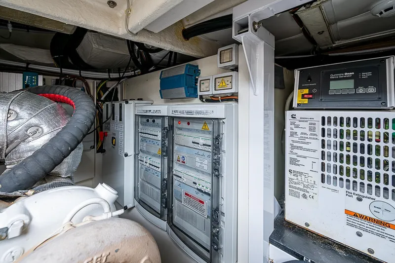  Yacht Photos Pics Engine room of 2021 Ferretti Yachts 500, featuring control panels and generator.