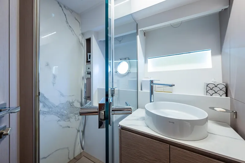  Yacht Photos Pics Luxurious bathroom interior of 2021 Ferretti Yachts 500, featuring modern sink and elegant design.