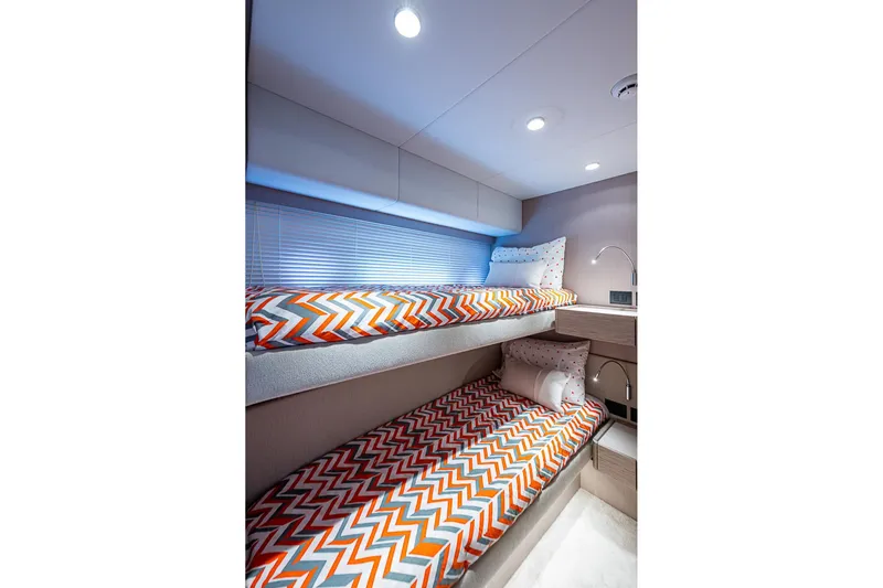  Yacht Photos Pics Bunk beds with colorful zigzag bedding in 2021 Ferretti Yachts 500 interior cabin.