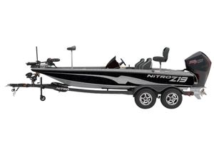 2026 Nitro Z19 XL bass boat with trailer, side view, sleek design, black and silver finish.