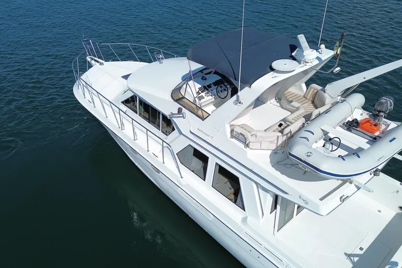 Barkruiser Yacht Photos Pics Aerial view of 1998 Navigator 4800 yacht on calm water.